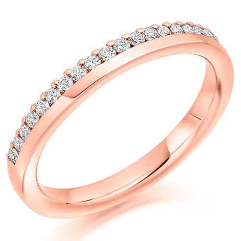 Ladies round brilliant offset claw set diamond wedding ring